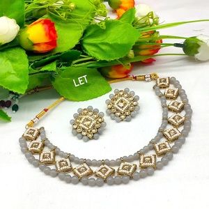 Gold plated crystal stone and beads necklace set with earrings.